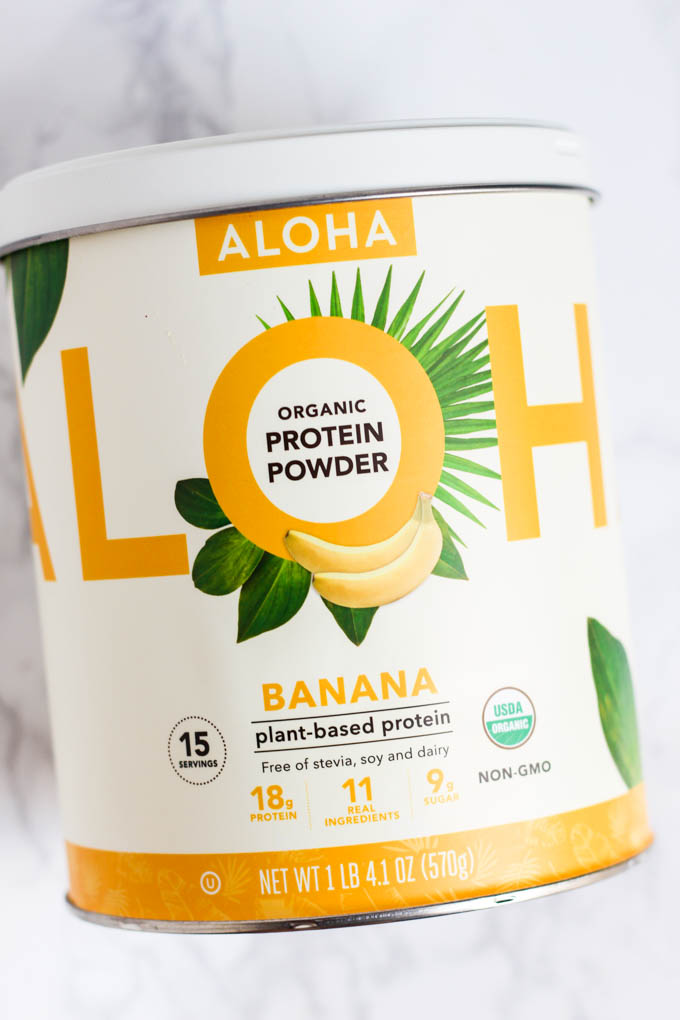 A canister of ALOHA brand banana protein powder