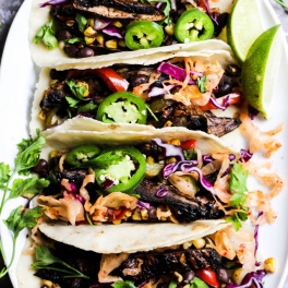 a platter filled with vegan mushroom tacos