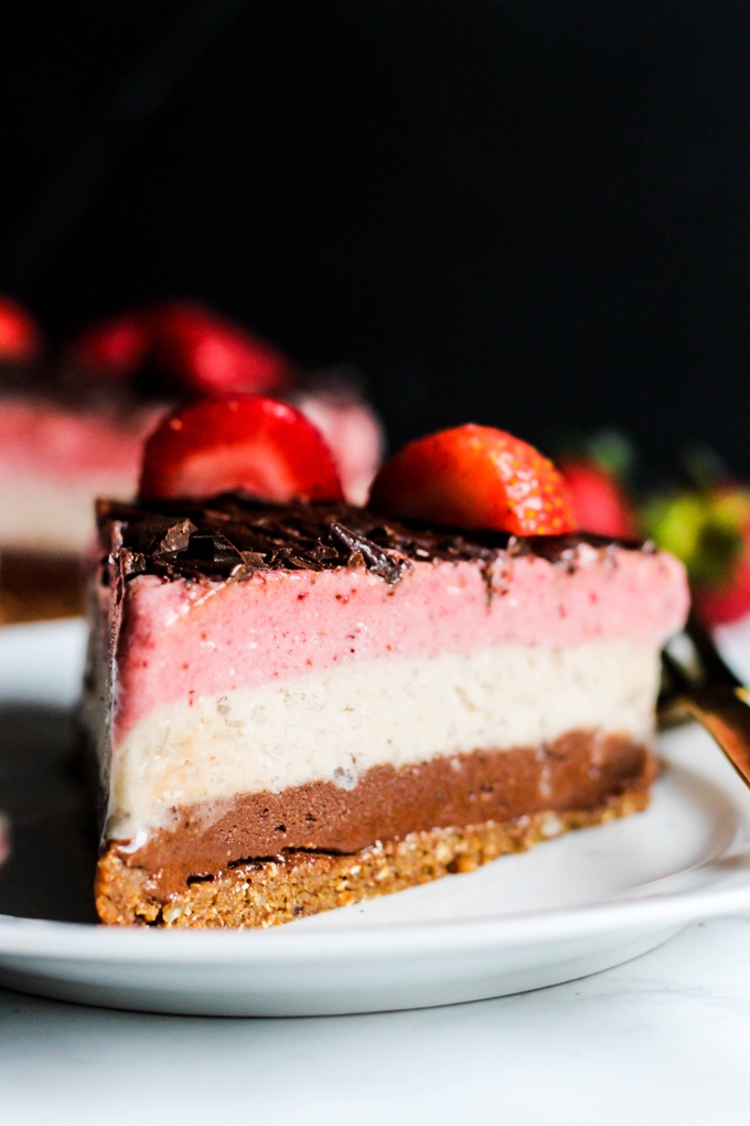 Why have just one ice cream flavor when you can have all three? This Neapolitan Banana Ice Cream cake is a creamy, decadent dessert for any occasion! Vegan & gluten-free.