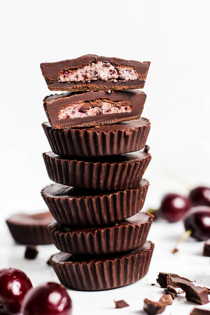 a stack of dark chocolate cherry coconut cups
