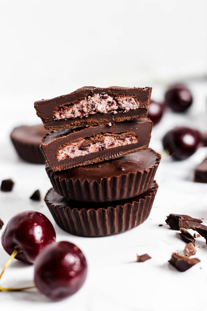 a stack of four cherry chocolate coconut butter cups