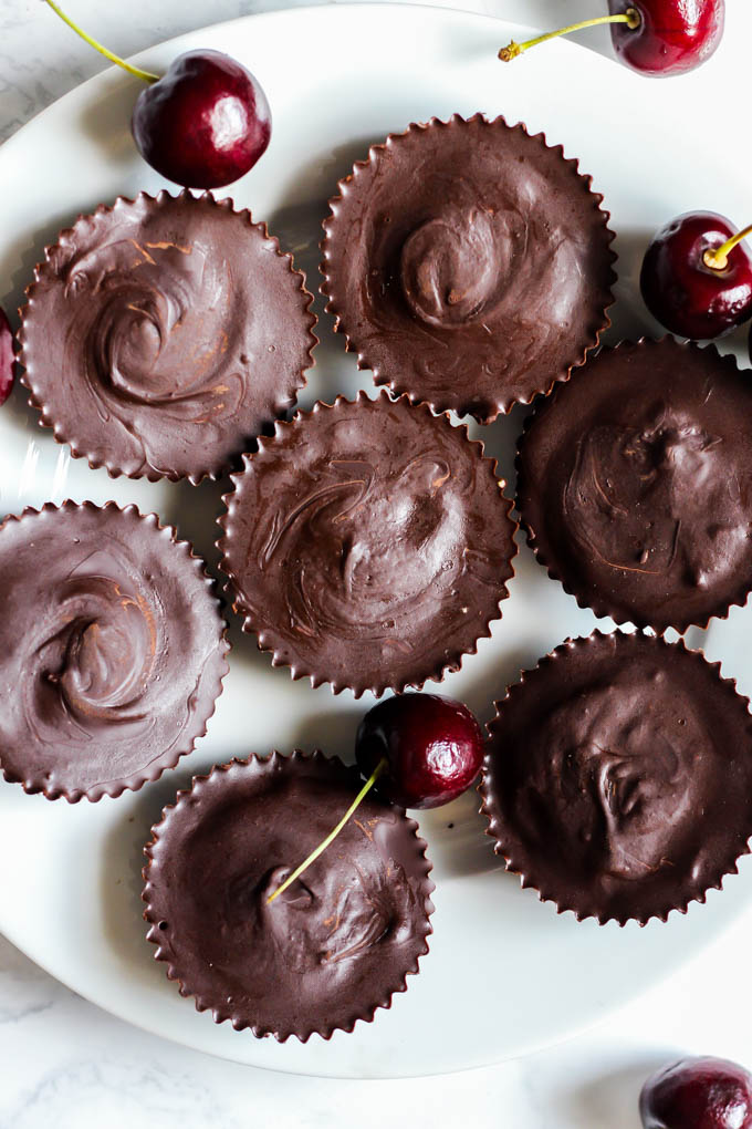 a plate of vegan dark chocolate coconut butter cups