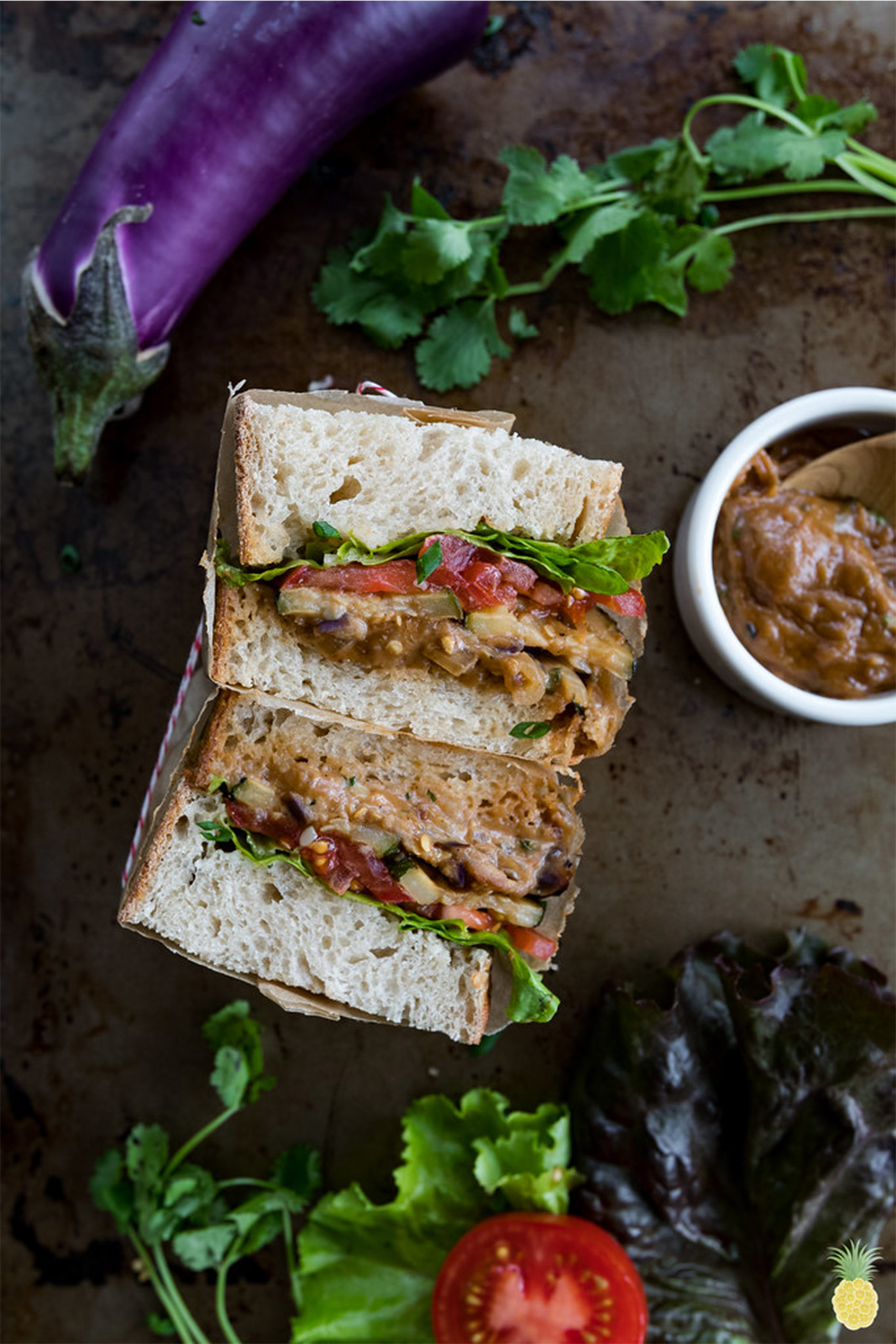 two halves of a peanut roasted vegetable sandwich