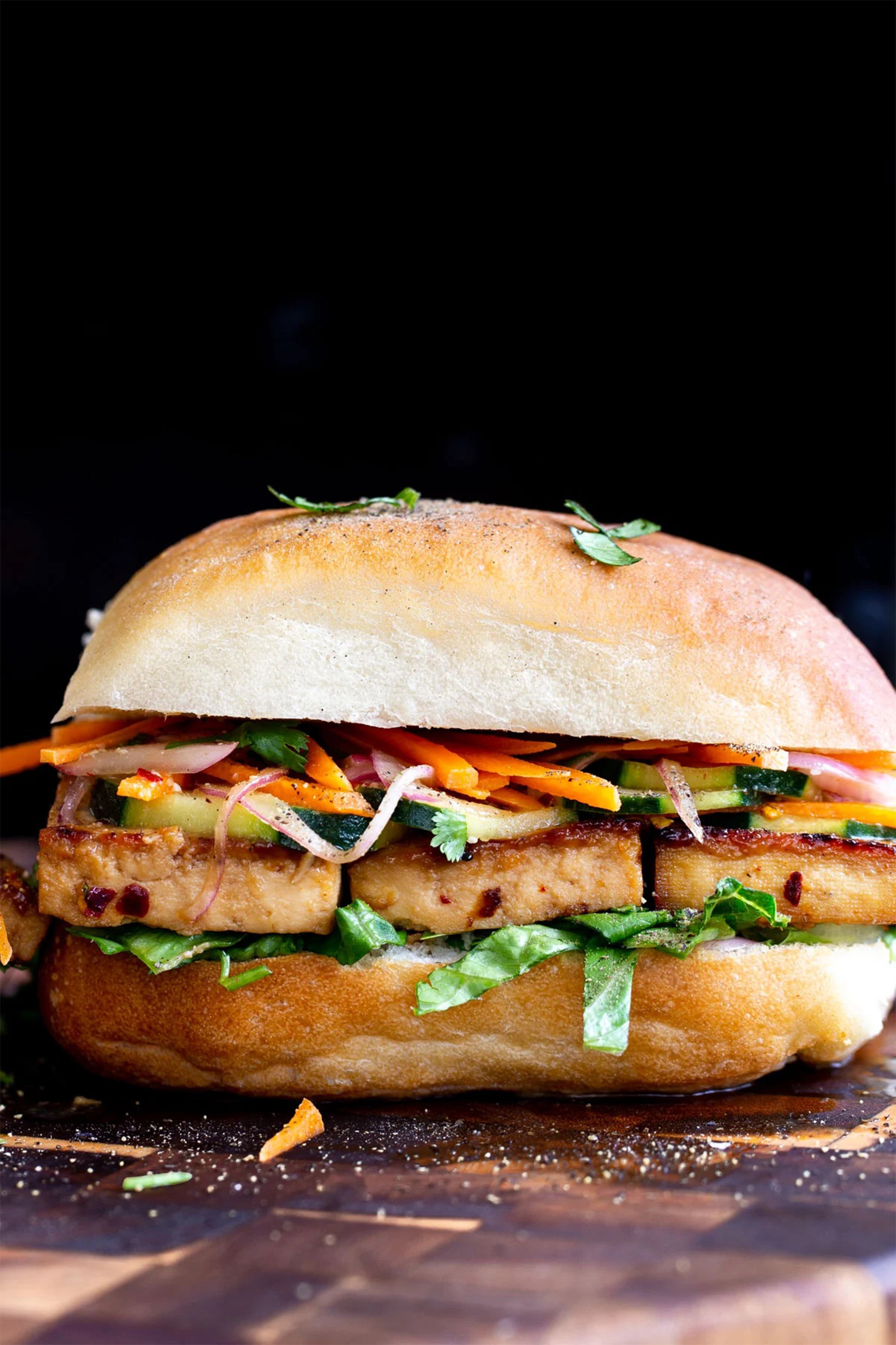 a vegan tofu sandwich served on a roll