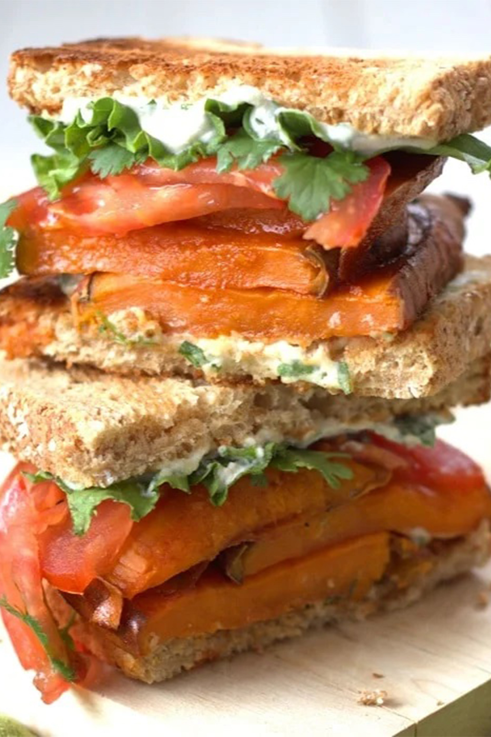 a sweet potato sandwich that has been sliced in half