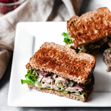 two halves of a vegan chicken salad sandwich