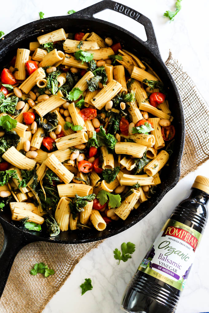 This One Pan Tomato and Kale Pasta will be a staple in your dinner rotation! It's made with simple ingredients & ready in 20 minutes. Vegan & gluten-free!