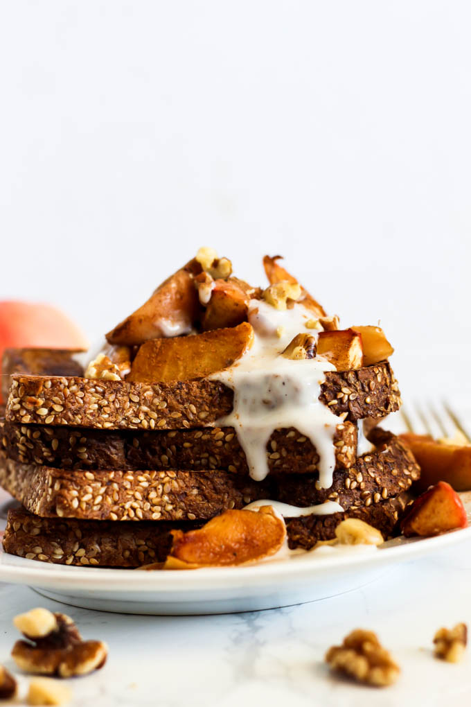 a stack of french toast served with stewed apples and vanilla yogurt