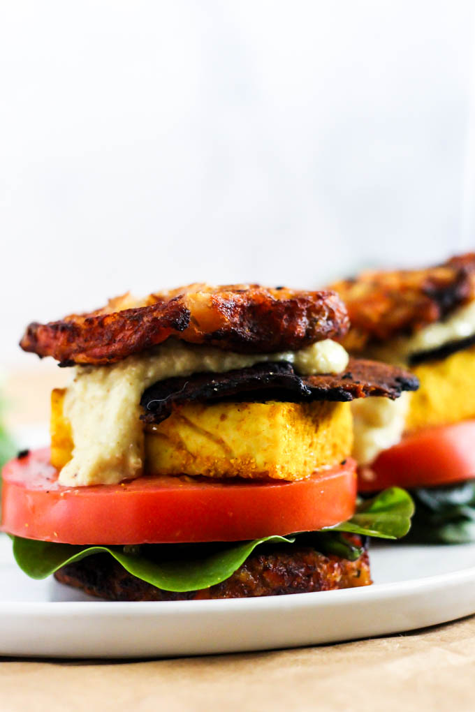 This Vegan Waffle Breakfast Sandwich is the ultimate brunch recipe to please everyone! It's loaded with hash browns, vegan bacon & dairy-free cheese. (gluten-free)