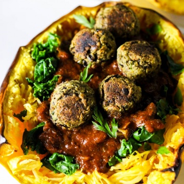 This Mushroom Spaghetti Squash recipe is a delicious, wholesome way to use seasonal squash! It's topped with a hearty mushroom sauce & vegan meatballs. (vegan & gluten-free)