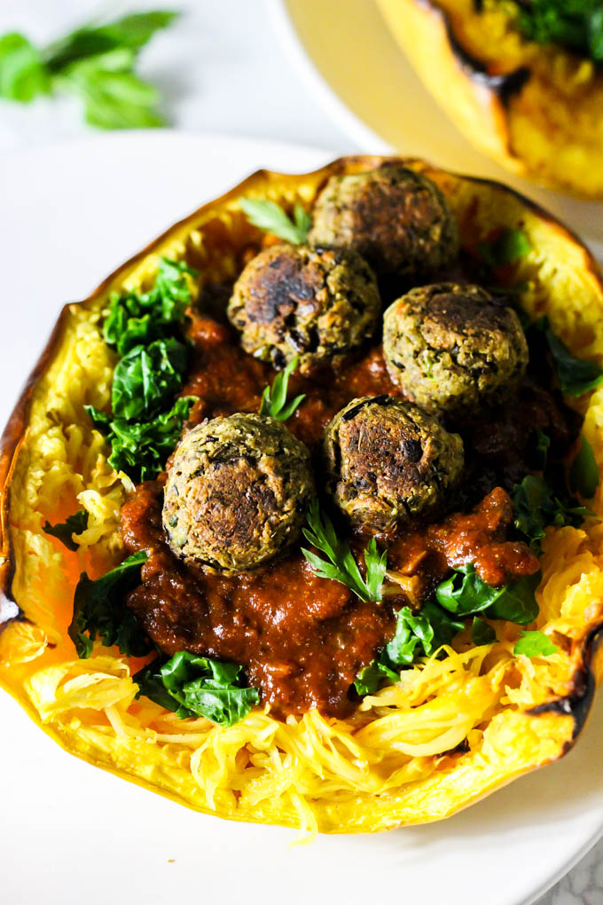 This Mushroom Spaghetti Squash recipe is a delicious, wholesome way to use seasonal squash! It's topped with a hearty mushroom sauce & vegan meatballs. (vegan & gluten-free)