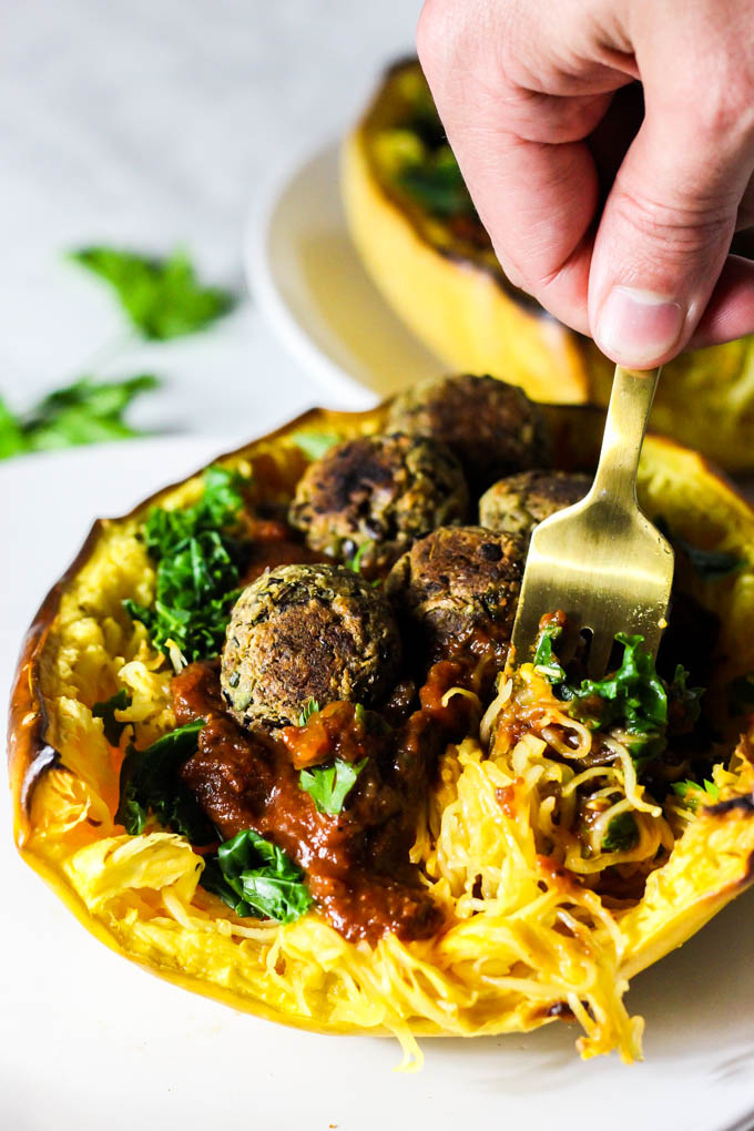 This Mushroom Spaghetti Squash recipe is a delicious, wholesome way to use seasonal squash! It's topped with a hearty mushroom sauce & vegan meatballs. (vegan & gluten-free)