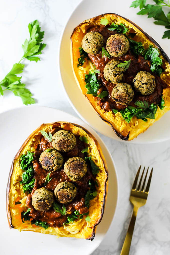 This Mushroom Spaghetti Squash recipe is a delicious, wholesome way to use seasonal squash! It's topped with a hearty mushroom sauce & vegan meatballs. (vegan & gluten-free)