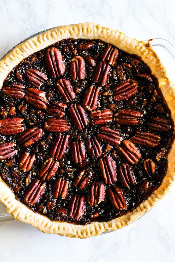 A slice of this Vegan Pecan Pie is all you need this holiday season! The sweet, gooey pecan filling tops a flaky crust that is irresistible. A must-have!