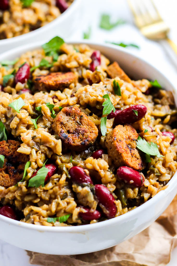 a bowl of jambalaya topped with parsley