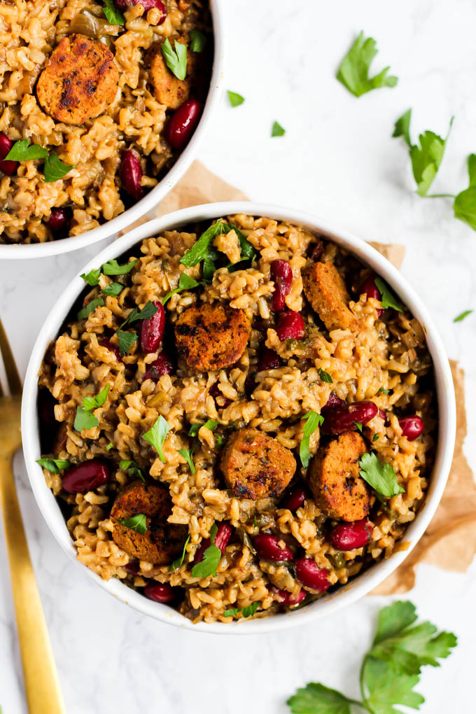 two bowls of vegan jambalaya topped with fresh parsley