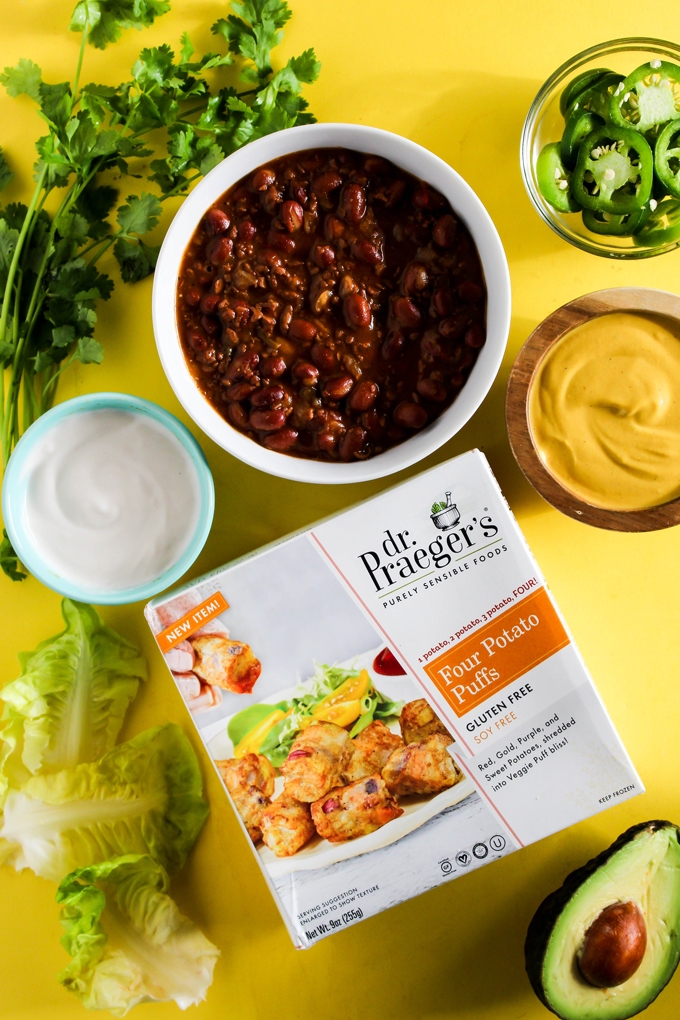 Serve up a plate of these Loaded Vegan Chili Cheese Tots as a delicious appetizer perfect for sharing! Full of bean chili, dairy-free cheese, and veggies.