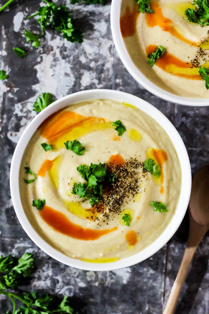 This Roasted Garlic Cauliflower Soup is a cozy bowl of wholesome ingredients that’s perfect as a side dish or main meal! Vegan, gluten-free, done in 1 hour.