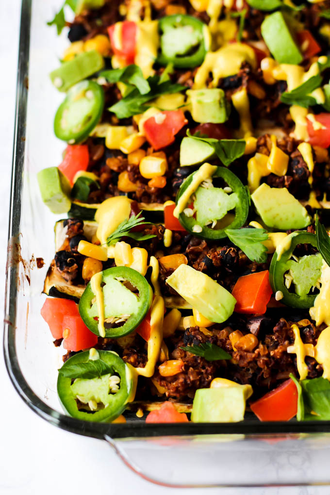 These easy Mexican Stuffed Zucchini make a balanced dinner with whole grains, vegetables & plant protein! Top with avocado & cashew cheese for more flavor.