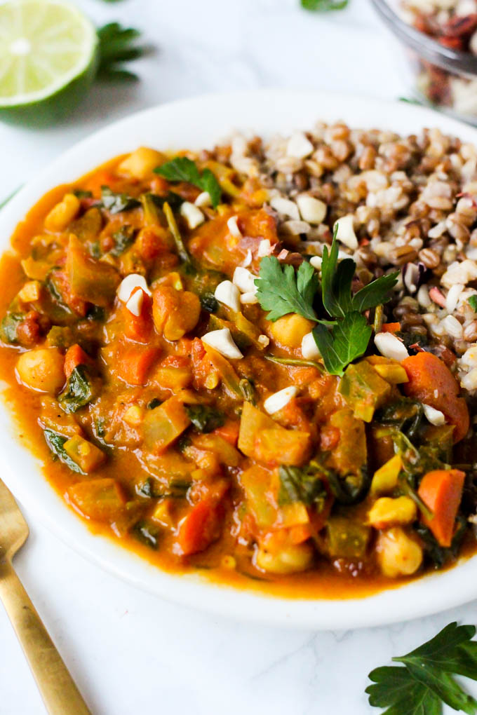a chickpea peanut stew served with lime and cilantro