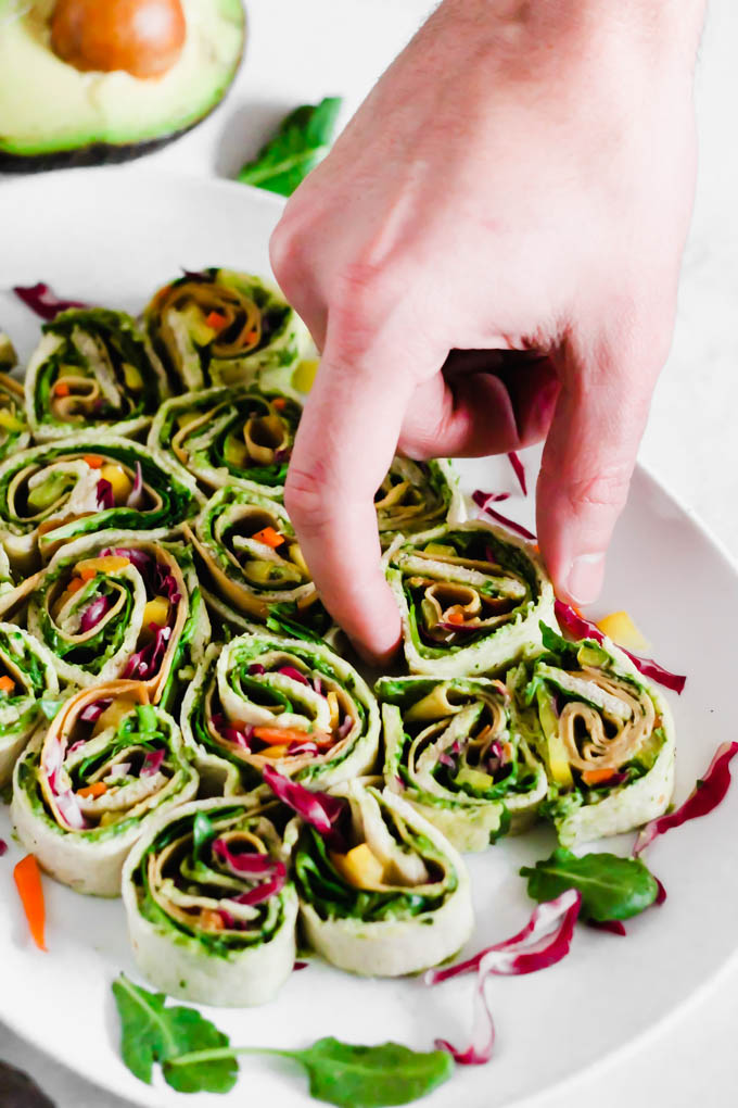 Your game day appetizer tray is not complete without these Avocado Deviled Potatoes & Creamy Avocado Pesto Pinwheels—easy plant-based finger foods for kids and adults alike!