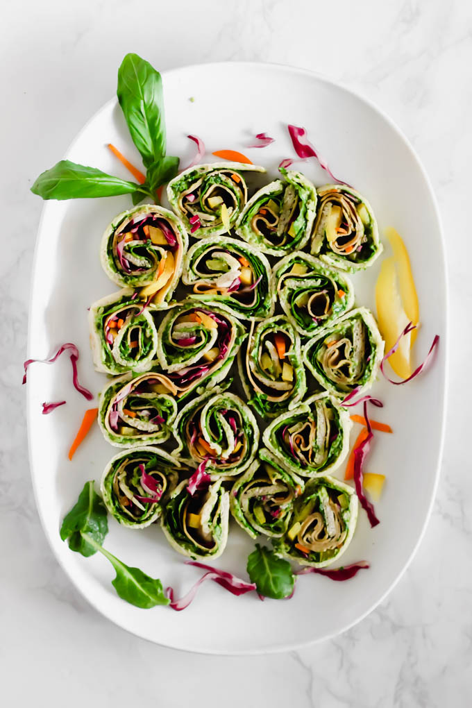 Your game day appetizer tray is not complete without these Avocado Deviled Potatoes & Creamy Avocado Pesto Pinwheels—easy plant-based finger foods for kids and adults alike!