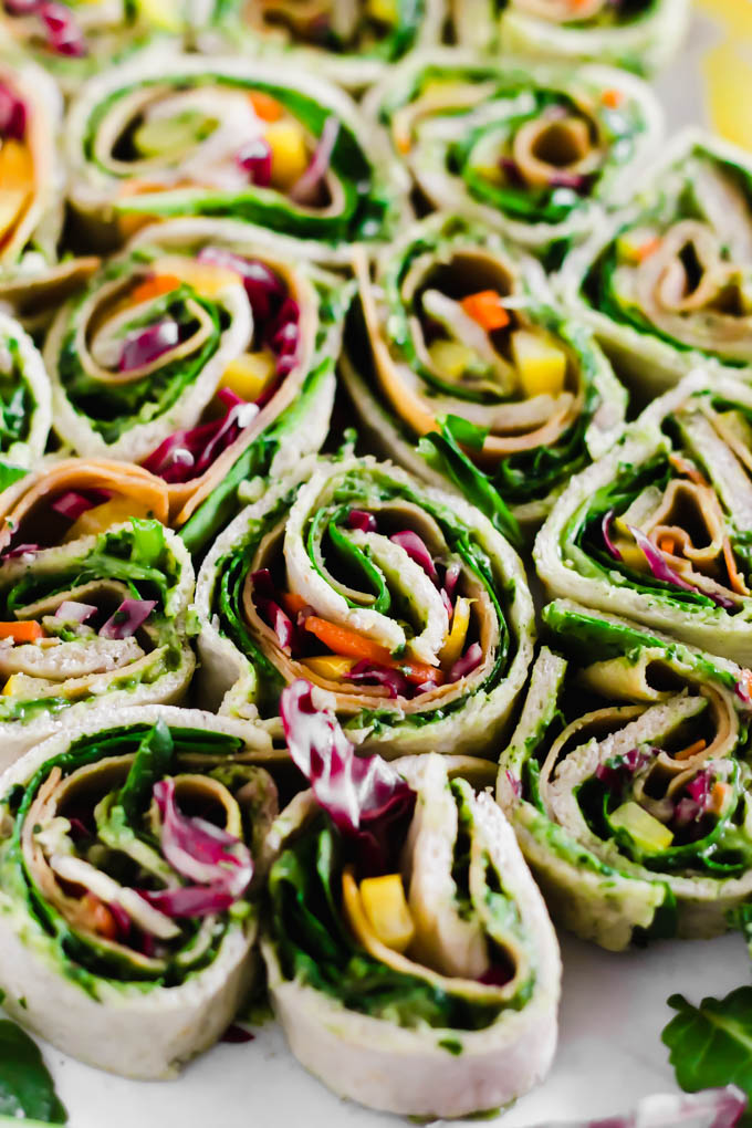 Your game day appetizer tray is not complete without these Avocado Deviled Potatoes & Creamy Avocado Pesto Pinwheels—easy plant-based finger foods for kids and adults alike!