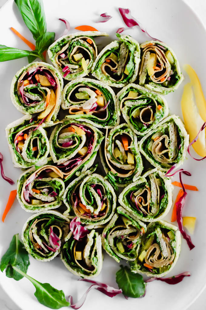 Your game day appetizer tray is not complete without these Avocado Deviled Potatoes & Creamy Avocado Pesto Pinwheels—easy plant-based finger foods for kids and adults alike!