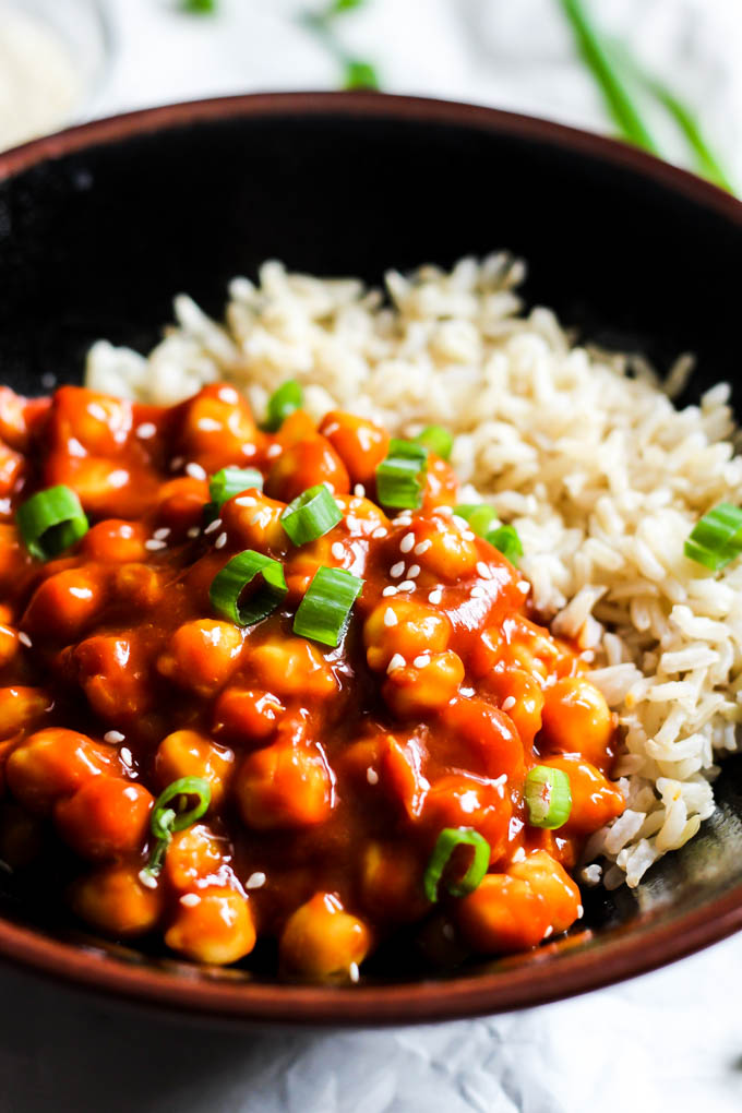 A bowl of sweet and sour chickpeas with brown rice