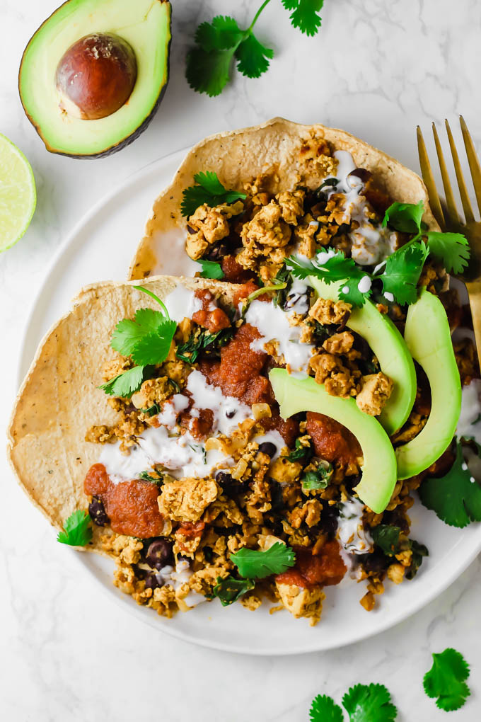 This protein-packed Vegan No-Huevos Rancheros dish is the perfect savory meal to serve for brunch, lunch, or dinner! Top with zesty ranchero sauce and tangy dairy-free sour cream for the ultimate plate.