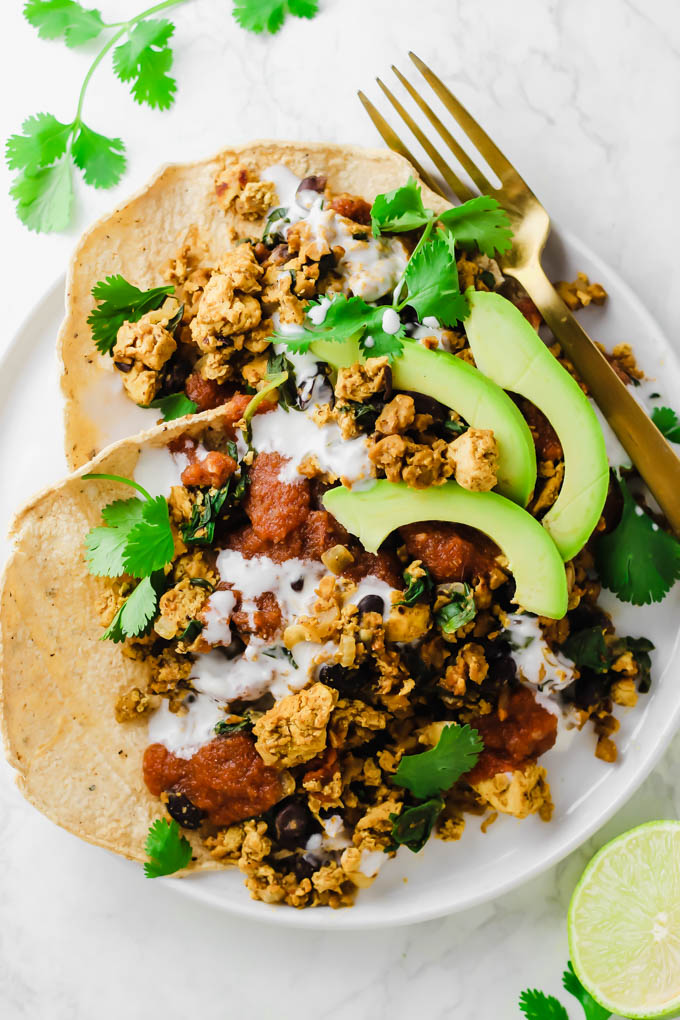 This protein-packed Vegan No-Huevos Rancheros dish is the perfect savory meal to serve for brunch, lunch, or dinner! Top with zesty ranchero sauce and tangy dairy-free sour cream for the ultimate plate.