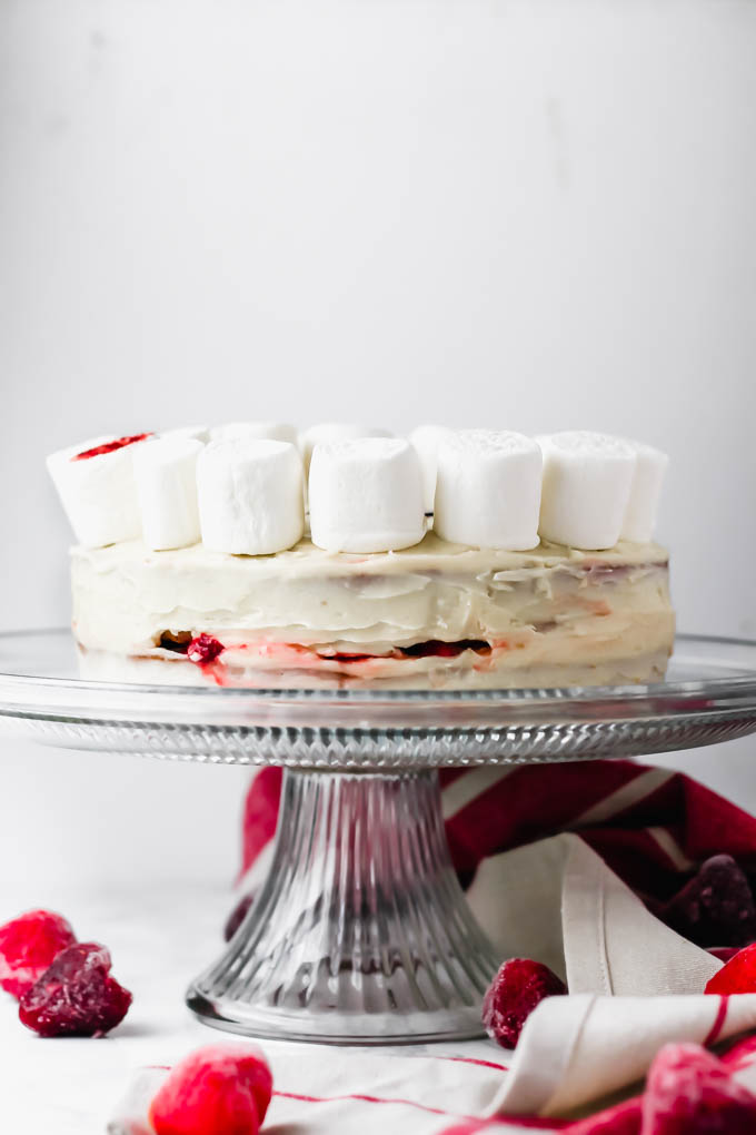 This fluffy, decadent Vegan Vanilla Strawberry Cake is perfect for any occasion—Easter, baby showers, birthday parties, you name it! To make it extra special for Easter, the cake is decorated with a marshmallow lamb.