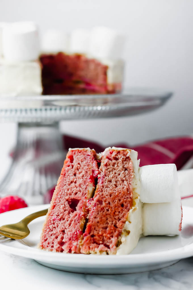 This fluffy, decadent Vegan Vanilla Strawberry Cake is perfect for any occasion—Easter, baby showers, birthday parties, you name it! To make it extra special for Easter, the cake is decorated with a marshmallow lamb.