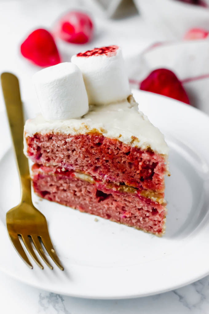 This fluffy, decadent Vegan Vanilla Strawberry Cake is perfect for any occasion—Easter, baby showers, birthday parties, you name it! To make it extra special for Easter, the cake is decorated with a marshmallow lamb.