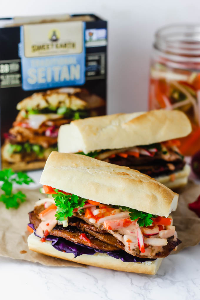 Layers of seitan are piled high with pickled vegetables and Sriracha mayo on a fluffy baguette in this Vegan Banh Mi! These satisfying sandwiches are great for packable lunches or to serve to a crowd.