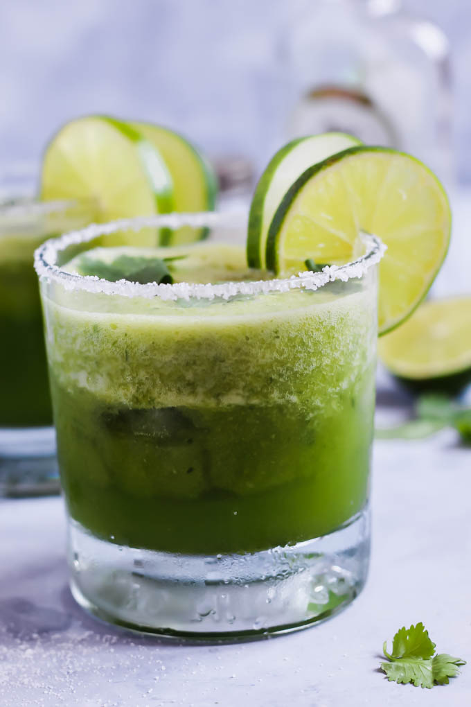 These Cilantro Cucumber Margaritas are a cool, refreshing twist on this classic cocktail! The cucumber is blended in for ultimate flavor. These pair perfectly with chips & salsa!