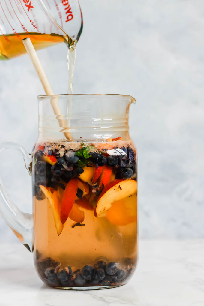 These Peach Blueberry Sangria Mocktails are packed with seasonal summer fruit for refreshing, non-alcoholic drinks for all ages to enjoy! They’re infused with fresh mint and apple cider vinegar for extra flavor.