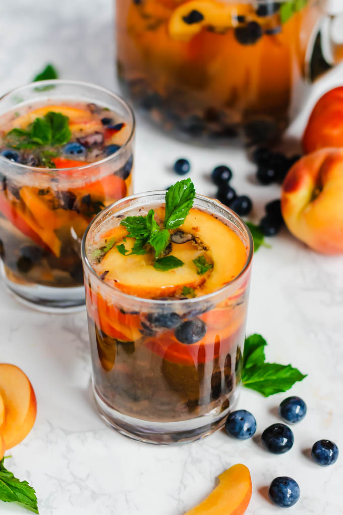 These Peach Blueberry Sangria Mocktails are packed with seasonal summer fruit for refreshing, non-alcoholic drinks for all ages to enjoy! They’re infused with fresh mint and apple cider vinegar for extra flavor.