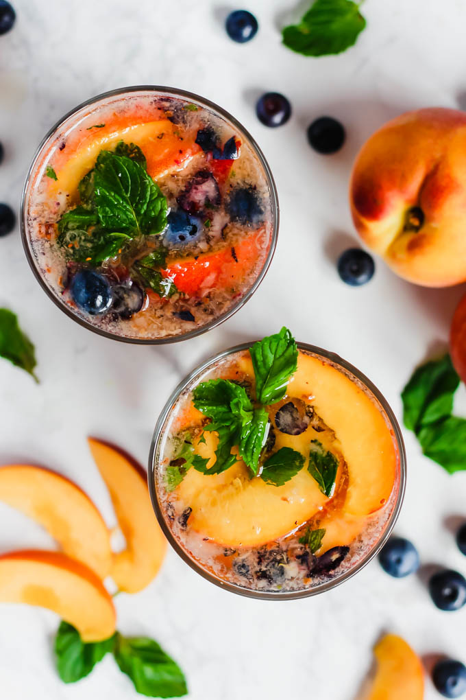 These Peach Blueberry Sangria Mocktails are packed with seasonal summer fruit for refreshing, non-alcoholic drinks for all ages to enjoy! They’re infused with fresh mint and apple cider vinegar for extra flavor.