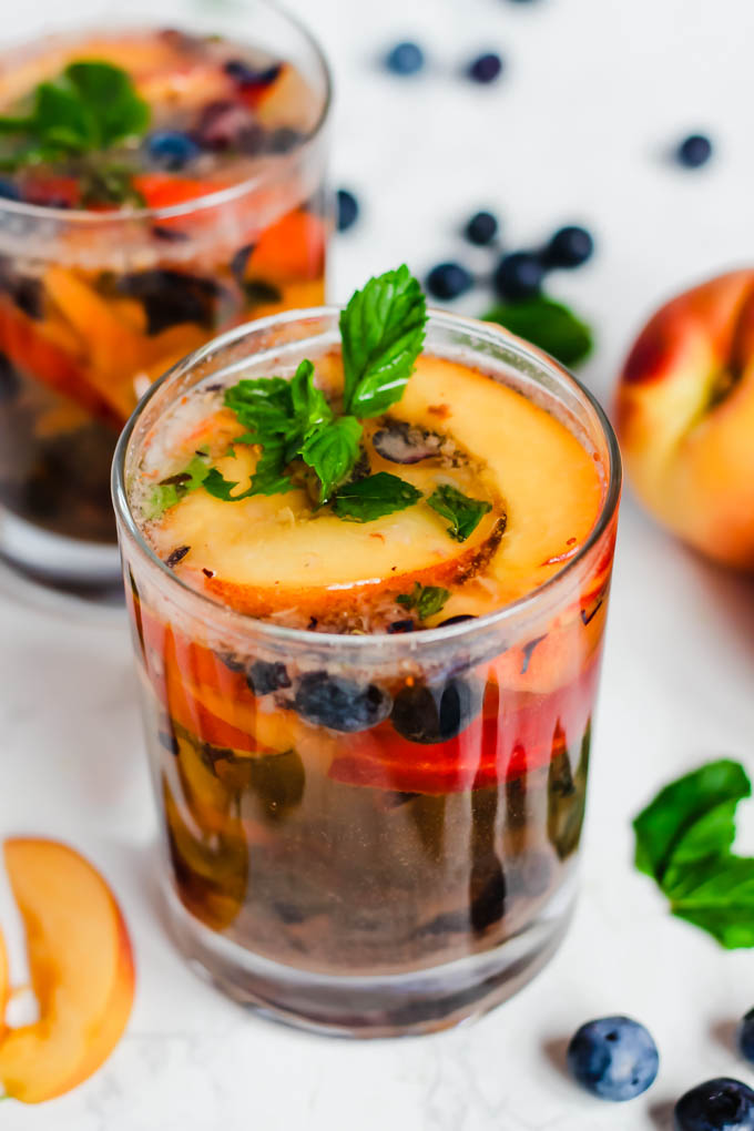 These Peach Blueberry Sangria Mocktails are packed with seasonal summer fruit for refreshing, non-alcoholic drinks for all ages to enjoy! They’re infused with fresh mint and apple cider vinegar for extra flavor.