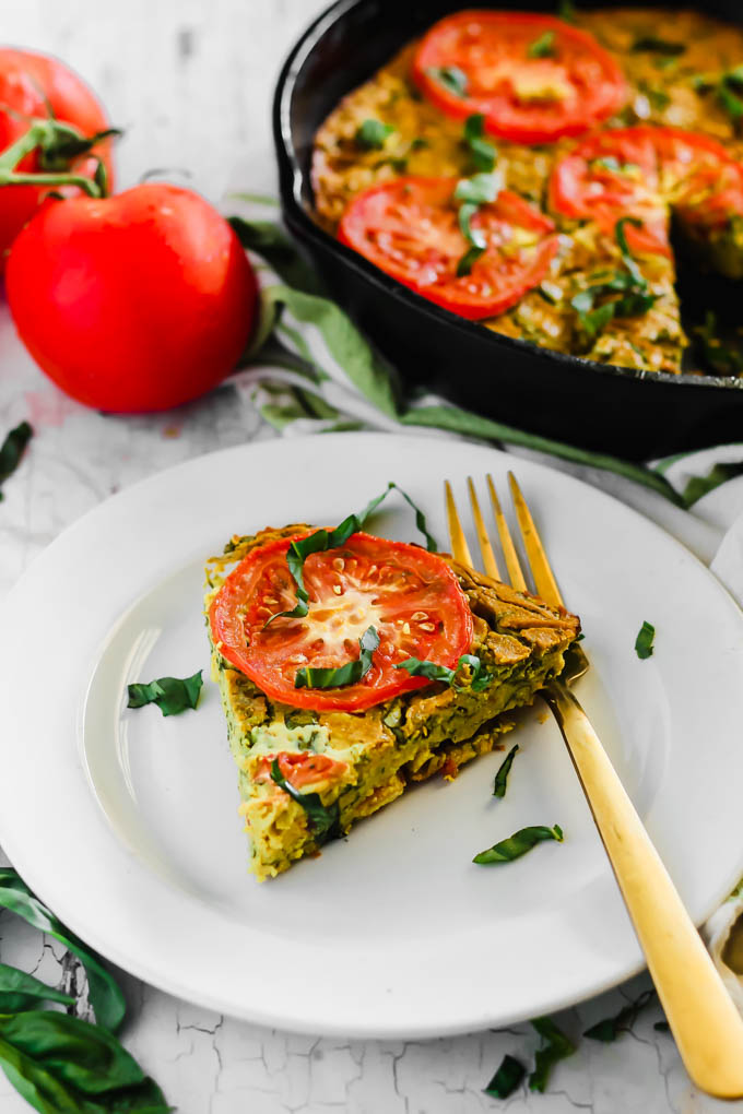 Serve this Vegan Caprese Quiche as a savory breakfast option full of plant protein thanks to chickpea flour and tofu! The seasonal tomatoes and basil make this a delicious, wholesome summer meal. (gluten-free)