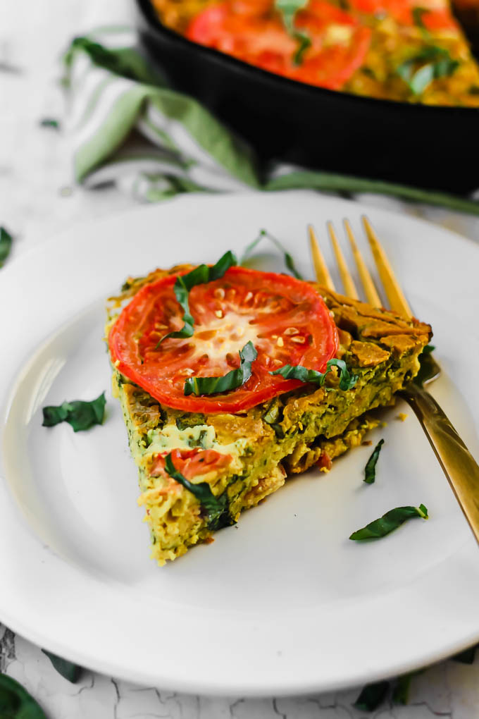 Serve this Vegan Caprese Quiche as a savory breakfast option full of plant protein thanks to chickpea flour and tofu! The seasonal tomatoes and basil make this a delicious, wholesome summer meal. (gluten-free)