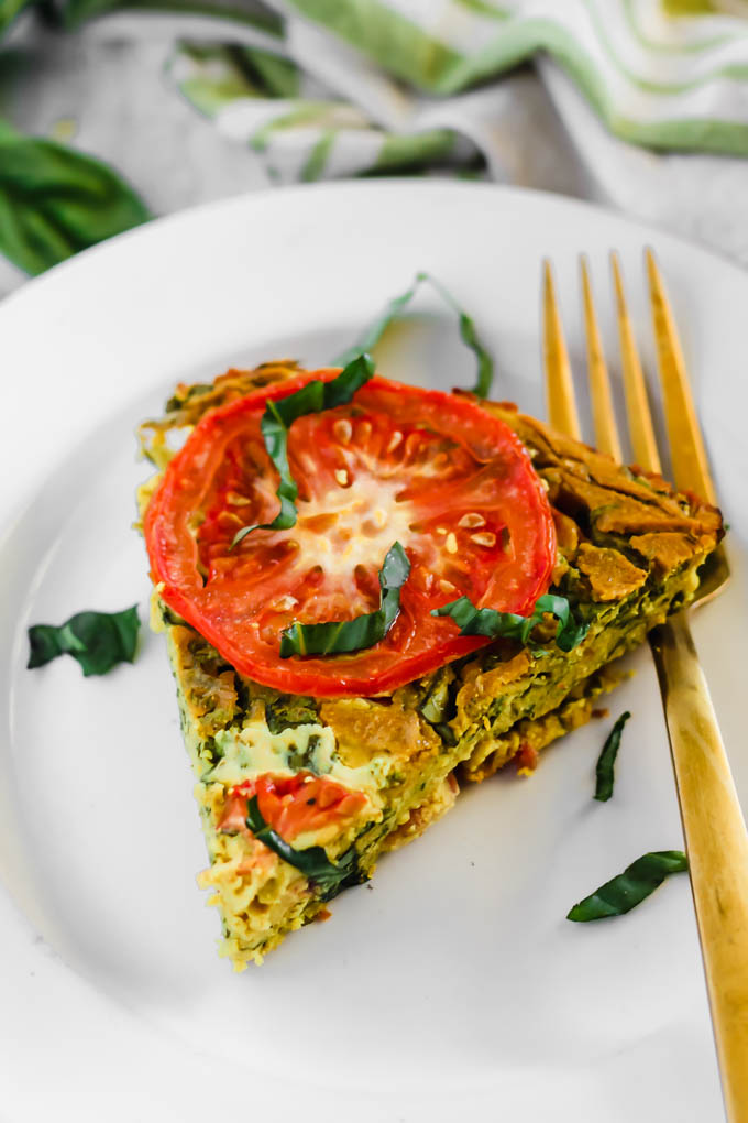 Serve this Vegan Caprese Quiche as a savory breakfast option full of plant protein thanks to chickpea flour and tofu! The seasonal tomatoes and basil make this a delicious, wholesome summer meal. (gluten-free)