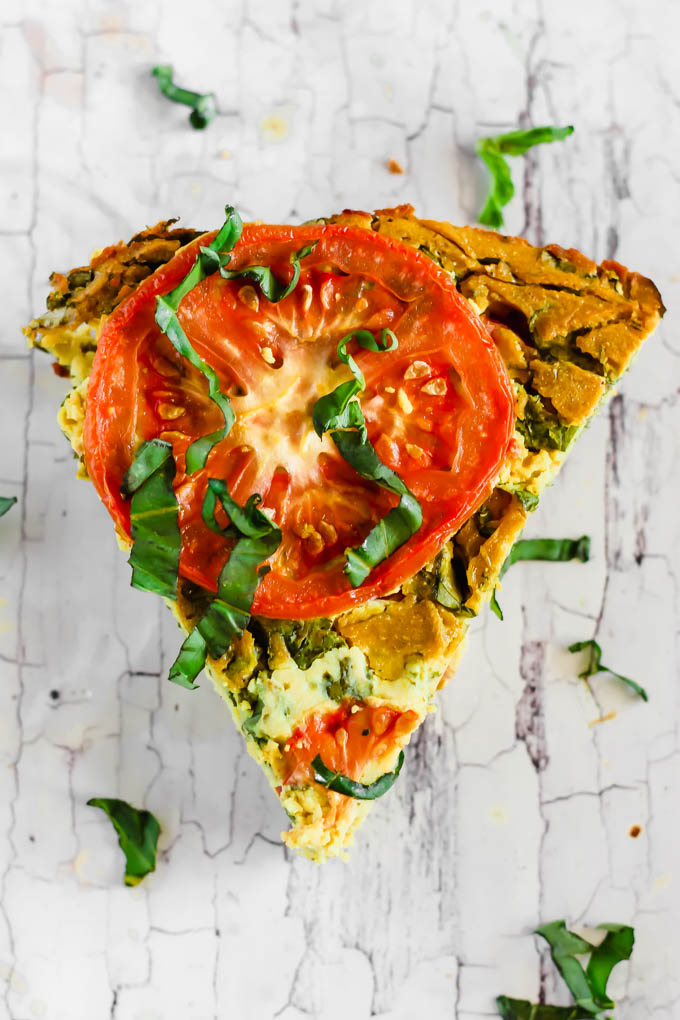 Serve this Vegan Caprese Quiche as a savory breakfast option full of plant protein thanks to chickpea flour and tofu! The seasonal tomatoes and basil make this a delicious, wholesome summer meal. (gluten-free)