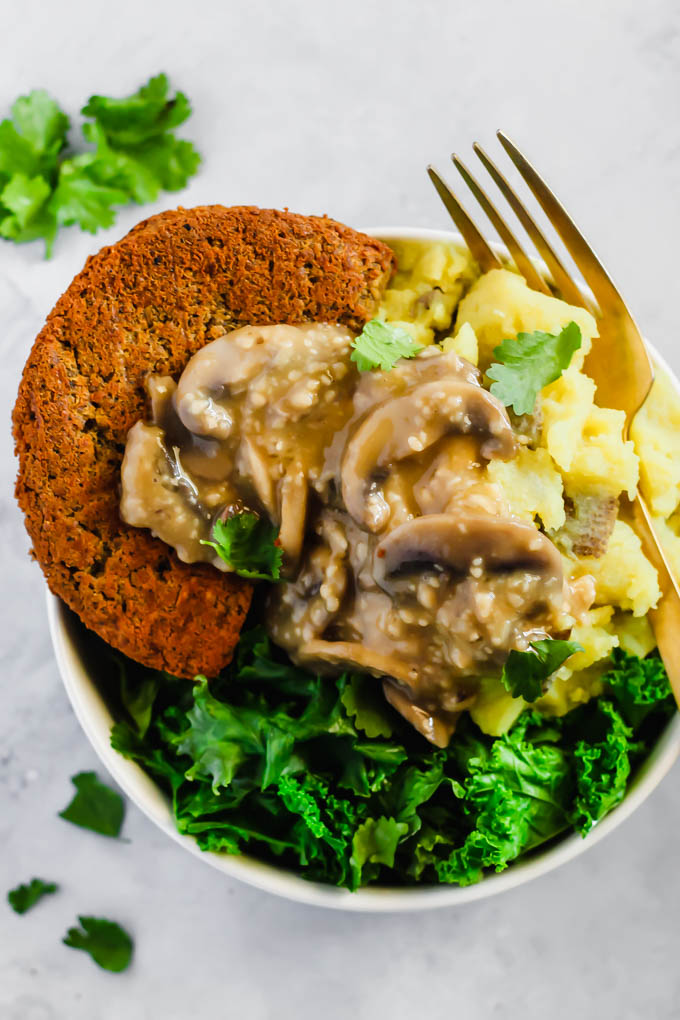 These Vegan Hamburger Steaks make a savory meatless dinner that everyone at the table will love. Serve them with mashed potatoes & mushroom gravy to take them to the next level!