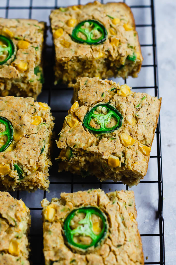 slices of cornbread topped with sliced jalapeno