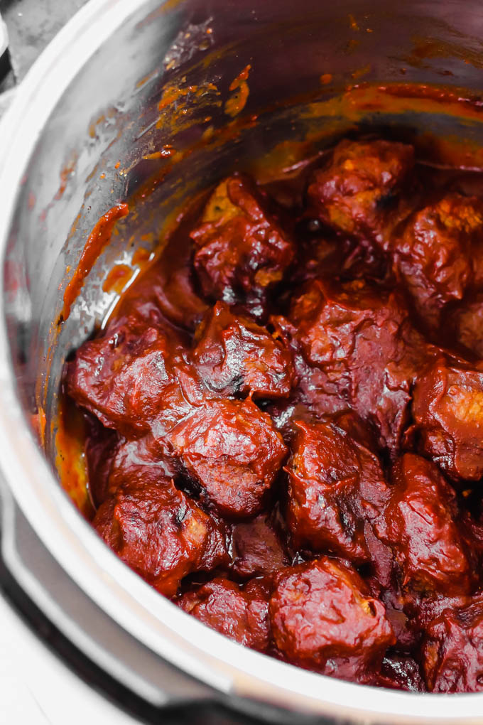 a slow cooker filled with barbecue meatballs