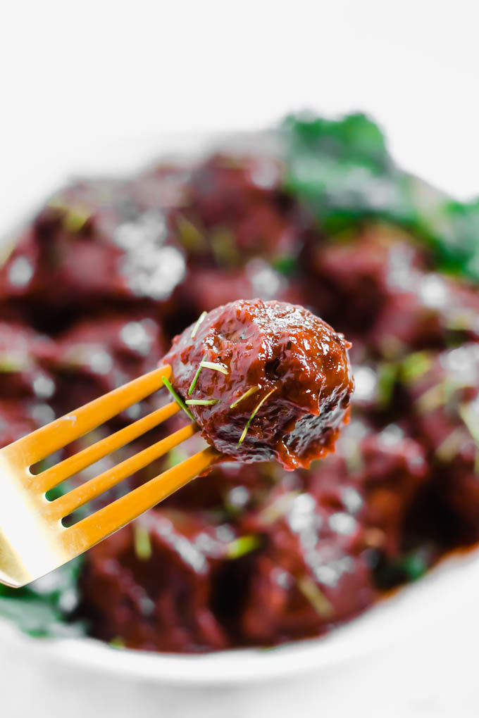 a fork stabbing a meatball