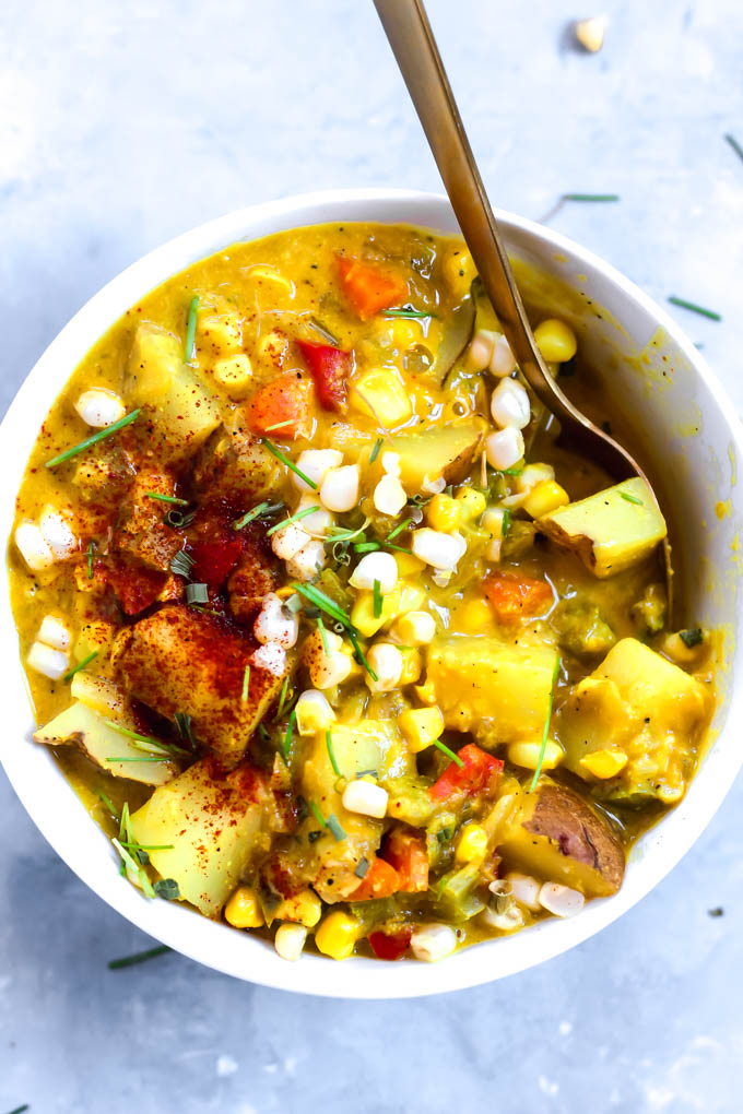green chile corn chowder topped with fresh corn