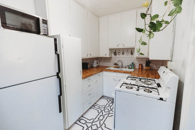 Check out my renter-friendly, affordable apartment makeover—from basic and beige to a bright, boho, modern space full of plants and DIYs! 
